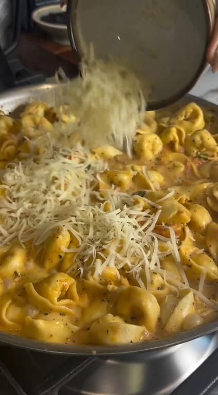 Adding grated Parmesan cheese