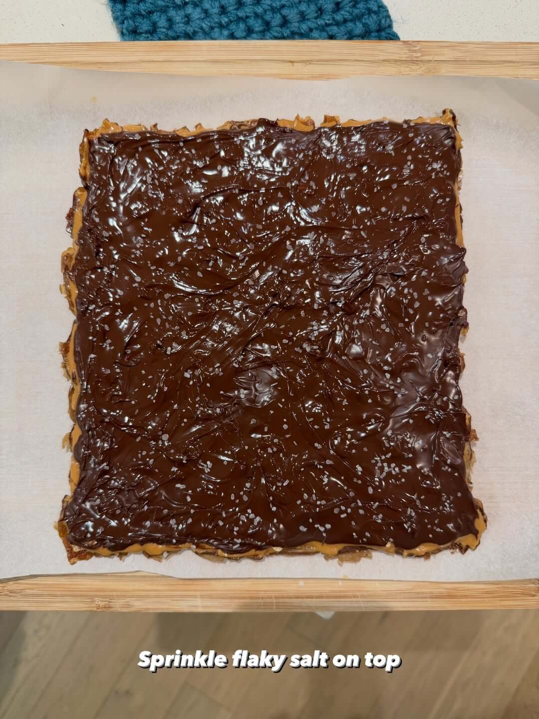 Spread melted dark chocolate and sprinkle flaky salt