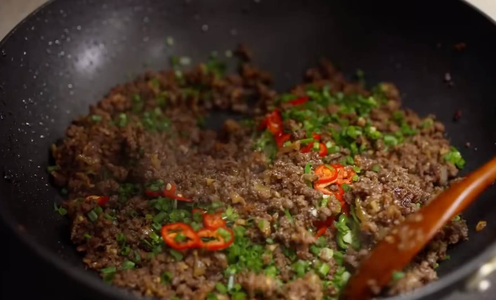 Finishing Beef With Sesame Oil and herbs
