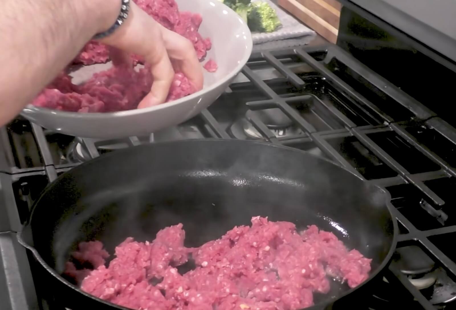 Ground beef cooking in a hot skillet